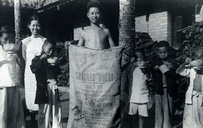 Refugees with Red Cross Gift